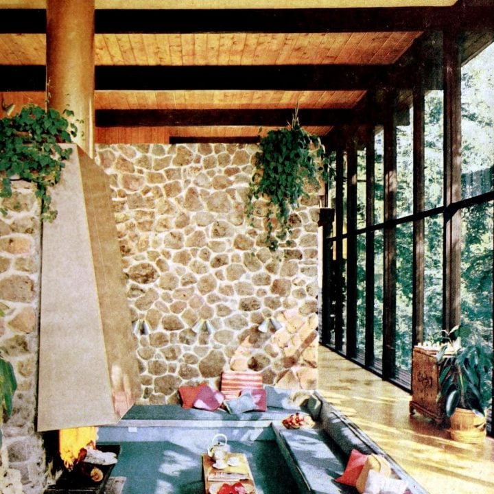 A conversation pit by a fireplace was the center of this two-story living room