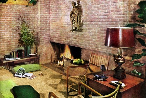 A sprawling brick fireplace wall defined this contemporary living room (1950s)