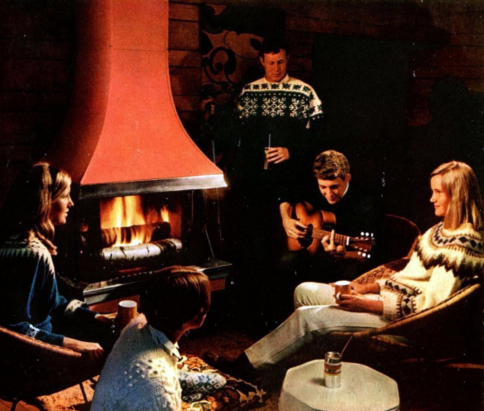 Stylish retro prefab fireplaces brought modern comfort to mid-century homes 15 Family around orange-red metal prefab fireplace (1967) via ClickAmericana com