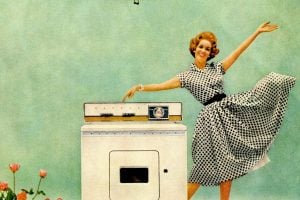 Happy housewife with a Maytag washer in 1959
