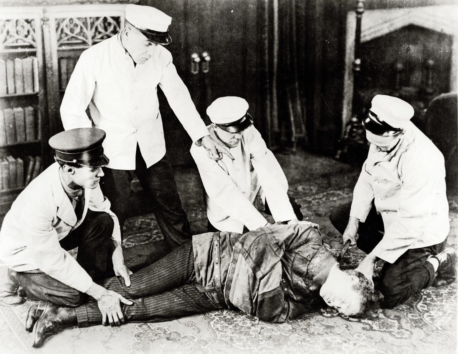 Harry Houdini in a straitjacket via ClickAmericana com