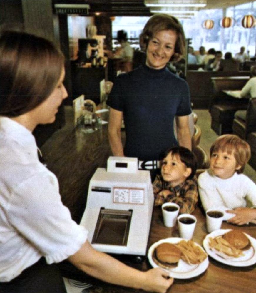 Paying for fast food in 1972 via ClickAmericana com