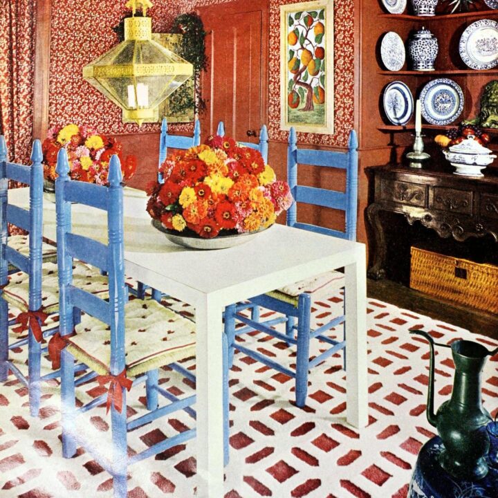 See a cute country-style living room in brick red and cornflower blue