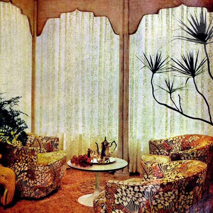 Sheer curtains filled this retro living room's tall window walls (1967)