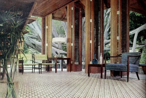 Soaring ceilings and mosaic tile floors make this non-traditional 50s living room memorable