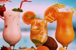 Summer drinks with blur beach on background