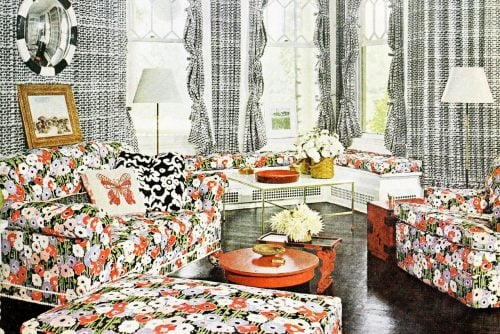 Vintage living room decor wtih printed fabric hanging on the walls