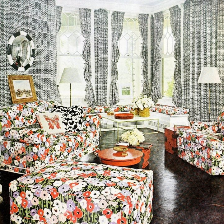 Vintage living room decor wtih printed fabric hanging on the walls
