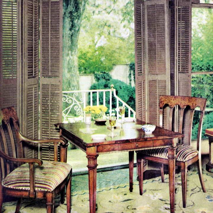 Wooden shutters perfectly framed this pretty little garden view dining area