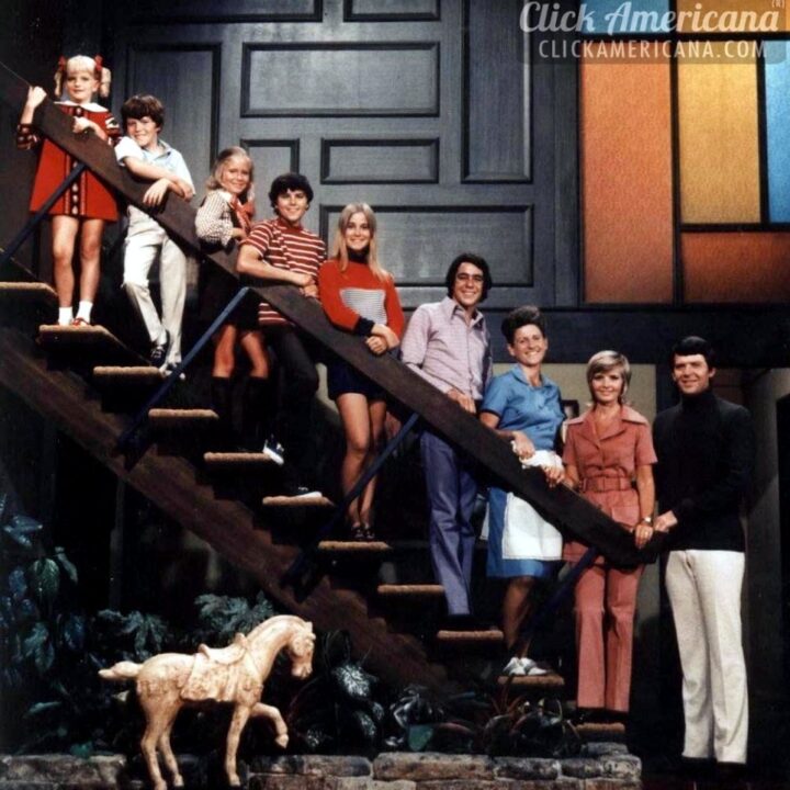 The Brady family on the stairs