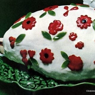 Cold glazed baked ham with pimiento flowers